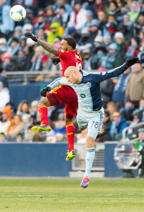 Trent Nelson  |  The Salt Lake Tribune
Real Salt Lake's Robbie Findley (10) and Sporting KC's Aurelien Collin (78) leap for the ball as Real Salt Lake faces Sporting KC in the MLS Cup Final at Sporting Park in Kansas City, Saturday December 7, 2013.