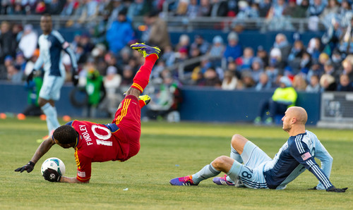 Trent Nelson  |  The Salt Lake Tribune
Real Salt Lake's Robbie Findley (10) is tripped up by Sporting KC's Aurelien Collin (78) as Real Salt Lake faces Sporting KC in the MLS Cup Final at Sporting Park in Kansas City, Saturday December 7, 2013.