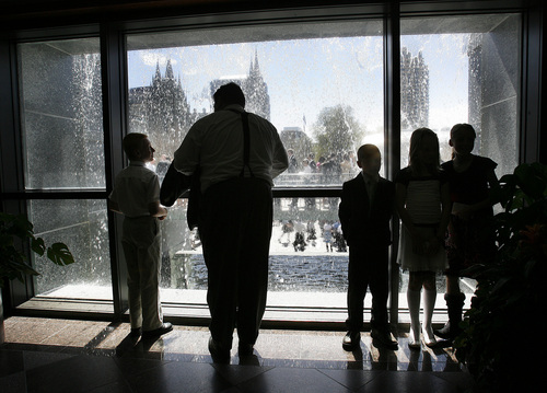 Scott Sommerdorf  |  Tribune file photo             
People attending conference take in the view through the Conference Center waterfall in 2012 as others wait in line to attend the Saturday afternoon session of the 182nd annual General Conference of the Church of Jesus Christ of Latter Day Saints.
