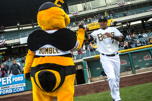 Chris Detrick  |  The Salt Lake Tribune
Salt Lake Bees' Luis Jimenez (7) high-fives Bumble as he is introduced during the game at Smith's Ballpark Friday April 4, 2014.