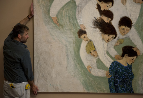 Lennie Mahler  |  The Salt Lake Tribune
Artist Brian Kershisnik straightens a painting on the first floor of the LDS Conference Center on Thursday, April 3, 2014.