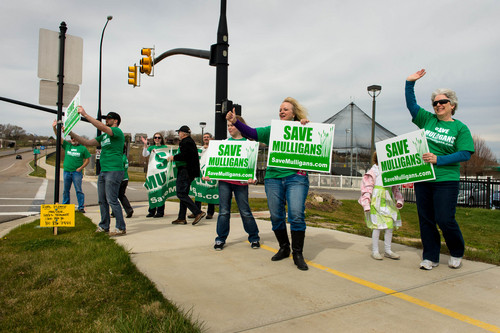 Trent Nelson  |  The Salt Lake Tribune
South Jordan residents held signs on Saturday to raise awareness with passing motorists as they work to save Mulligans Golf Course from development.