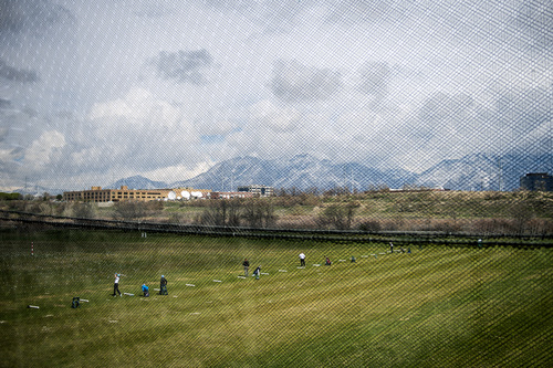 Chris Detrick  |  The Salt Lake Tribune
Golfers use the driving range at Mulligans Golf and Games near the undeveloped land across from the South Jordan Station at 10351 South Jordan Gateway Thursday April 3, 2014.