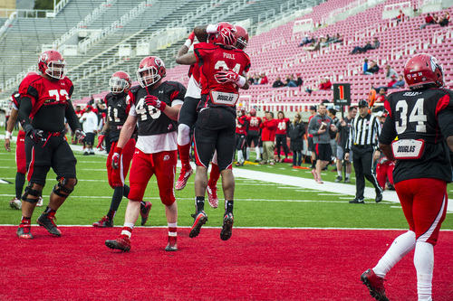 Chris Detrick  |  The Salt Lake Tribune
Utah Utes running back Bubba Poole (34) celebrates with Utah Utes Dominique Hatfield after scoring a touchdown during a scrimmage at Rice-Eccles Stadium Saturday April 5, 2014.