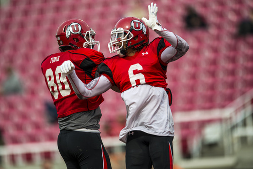 Chris Detrick  |  The Salt Lake Tribune
Utah Utes tight end Westlee Tonga (80) and Utah Utes wide receiver Dres Anderson (6) celebrate after a touchdown during a scrimmage at Rice-Eccles Stadium Saturday April 5, 2014.