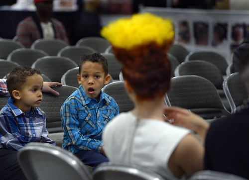 Scott Sommerdorf   |  The Salt Lake Tribune
Davontte' Madera, 7, center, checks out a "Reverse Psycho Billy" hairdo while sitting with his brother Da'Viel, left, at the Golden Shear Hair & Beauty Show. The show will showcase the skills of professionals from Salt Lake County and surrounding areas. It is sponsored by the Journeymens Barber League, Saturday, April 5, 2014.