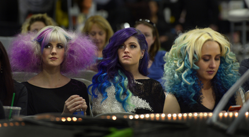 Scott Sommerdorf   |  The Salt Lake Tribune
Hanah Richards, left, Kenzie Keyes, and Sage Chamberlain at right watch as the "Best Pompadour" competition is underway at the Golden Shear Hair & Beauty Show. The show showcased the skills of professionals from Salt Lake County and surrounding areas. It is sponsored by the Journeymens Barber League, Saturday, April 5, 2014.