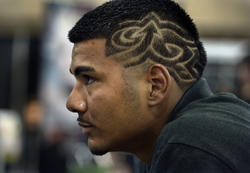 Scott Sommerdorf   |  The Salt Lake Tribune
Ken Lopez watches the "Best overall men's cut and style" competition after getting a cut from Matthew Campbell at the Golden Shear Hair & Beauty Show. The show showcased the skills of professionals from Salt Lake County and surrounding areas. It is sponsored by the Journeymens Barber League, Saturday, April 5, 2014.