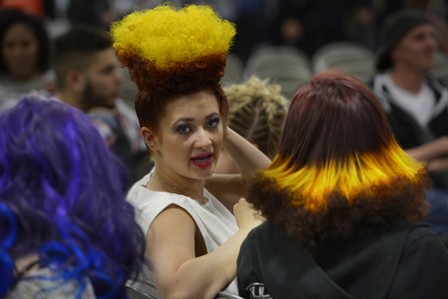 Scott Sommerdorf   |  The Salt Lake Tribune
A contestant with a "Reverse Psycho Billy" hairdo talks with friends at the Golden Shear Hair & Beauty Show. The show showcased the skills of professionals from Salt Lake County and surrounding areas. It is sponsored by the Journeymens Barber League, Saturday, April 5, 2014.