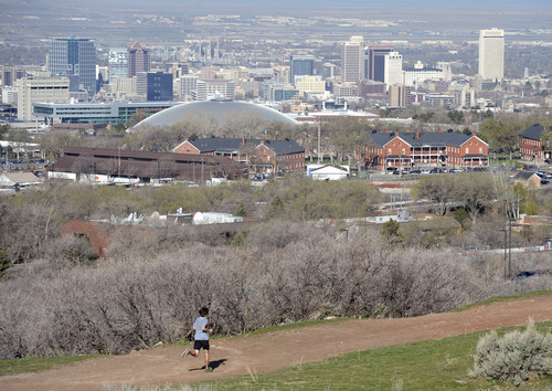 Al Hartmann  |  The Salt Lake Tribune
Runner strides out along the pipeline trail above Salt Lake City Monday April 7.  Weather this week should be dryer and warmer.