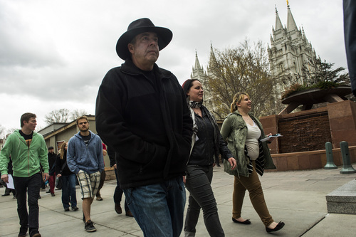 Chris Detrick  |  The Salt Lake Tribune
Atheists of Utah, ex-Mormons and disaffected, disbelieving Latter-day Saints march around Temple Square after the morning session of the 184th Annual General Conference of The Church of Jesus Christ of Latter-day Saints Sunday April 6, 2014. The American Atheists group is holding its national convention in Salt Lake City in two weeks, April 17-20.
