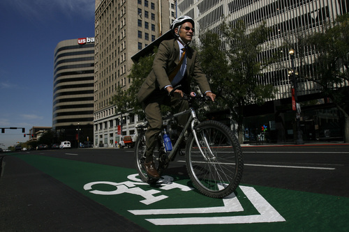 Mayor Ralph Becker rides his bike East along 200 South between Main and State Street Wednesday, September 17, 2008.  Mayor Ralph Becker conducted a press conference announcing the green stripe painted on the road along 200 South to designate the bike lines that will share space with cars on the road.


Chris Detrick/The Salt Lake Tribune