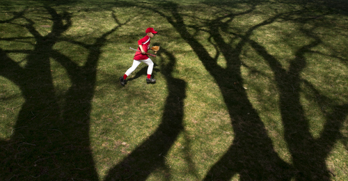 Keith Johnson | The Salt Lake Tribune

Carter Jacobson, 9, runs to join his Avenues Scorpions baseball team at Lindsey Gardens park in Salt Lake City, April 8, 2014.