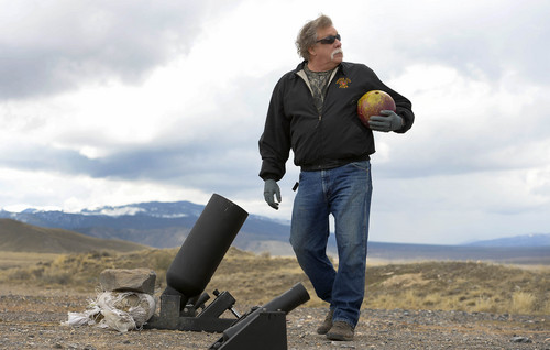 Leah Hogsten  |  The Salt Lake Tribune
Robert Kirby prepares to launch a bowling ball from a cannon he and friend Sonny Dyle recently purchased, Saturday, April 5, 2014 in Rush Valley, Utah.