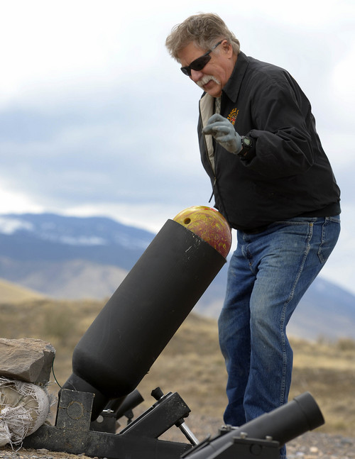 Leah Hogsten  |  The Salt Lake Tribune
Robert Kirby gingerly loads a bowling ball into the cannon to fire that he and friend Sonny Dyle recently purchased, Saturday, April 5, 2014 in Rush Valley, Utah.