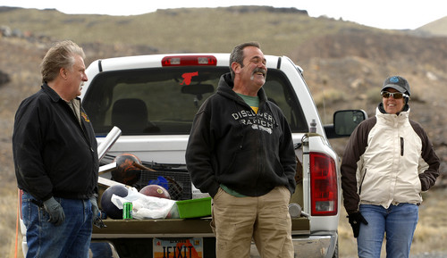 Leah Hogsten  |  The Salt Lake Tribune
l-r Robert Kirby and friends Sonny and Sue Dyle giggle at the result of firing bowling balls from a cannon they recently bought, Saturday, April 5, 2014 in Rush Valley, Utah.
