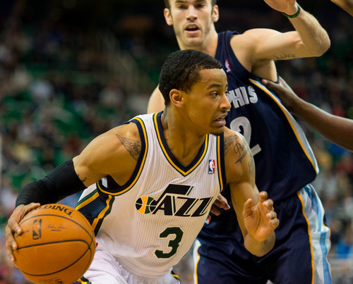 Trent Nelson  |  The Salt Lake Tribune
Utah Jazz guard Trey Burke (3) drives past Memphis Grizzlies guard Nick Calathes (12) as the Utah Jazz face the Memphis Grizzlies, NBA basketball at EnergySolutions Arena in Salt Lake City, Wednesday, March 26, 2014.