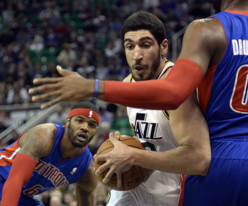 Rick Egan  | The Salt Lake Tribune 

Utah Jazz center Enes Kanter (0) gets past Detroit Pistons forward Josh Smith (6) and tries to get past Andre Drummond (0) in NBA action, Jazz vs. The Detriot Pistons, in the EnergySolutions Arena, Monday, March 24, 2014.