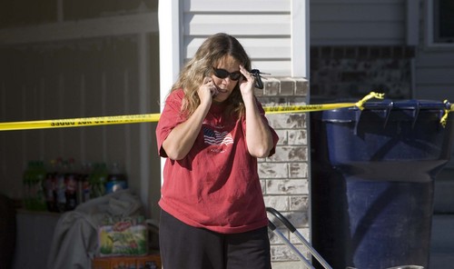 Paul Fraughton  |  The Salt Lake Tribune
Distraught Woods Cross resident Linda Wood makes phone calls while she stands outside her home that was condemned as a result of damage sustained in an explosion at the Silver Eagle Refinery on  Wednesday, Nov. 4, 2009.