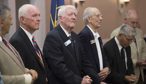 Steve Griffin  |  The Salt Lake Tribune


Clare H. Oliphant, a former prisoner of war from WW ll, center, stands with other former POW's during the Former POW Recognition Day luncheon at the Salt Lake Double Tree by Hilton in Salt Lake City Friday, April 11, 2014. The event is held each year on April 9, the day that a starving and exhausted U.S. military force at Bataan in the Philippines surrendered to the invading Japanese during World War II. Ten thousand American soldiers were marched some 70 miles to a POW camp. An estimated 600 to 650 service members died along the way. The rest faced years of brutal and deadly captivity in the Philippines and Japan. Some are still considered missing in action.