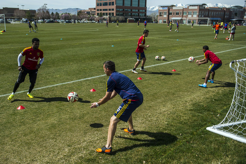 Chris Detrick  |  The Salt Lake Tribune
Real Salt Lake Head Athletic Trainer Tyson Pace works with Robbie Findley (10) Luis Gil (21) and Joao Plata (8) during a practice at America First Field Wednesday April 9, 2014.