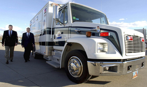 Michael Moffitt, now president of Gold Cross Ambulance Services, walks with then-President Jared Miles alongside the company's newest and most sophisticated ambulance, The Mobile Intensive Care Unit, in this 2003 photo.Ambulance services are among the medical providers getting millions from Medicare to carry older patients to Utah hospitals. Paul Fraughton/The Salt Lake Tribune.