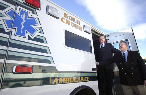 Gold Cross Ambulance Services' former President Jared D. Miles and current President Michael Moffitt, are shown in the doorway of one of their  ambulances in this 2003 photo. Ambulance services are among the medical providers getting millions from Medicare to carry older patients to Utah hospitals. Paul Fraughton/The Salt Lake Tribune