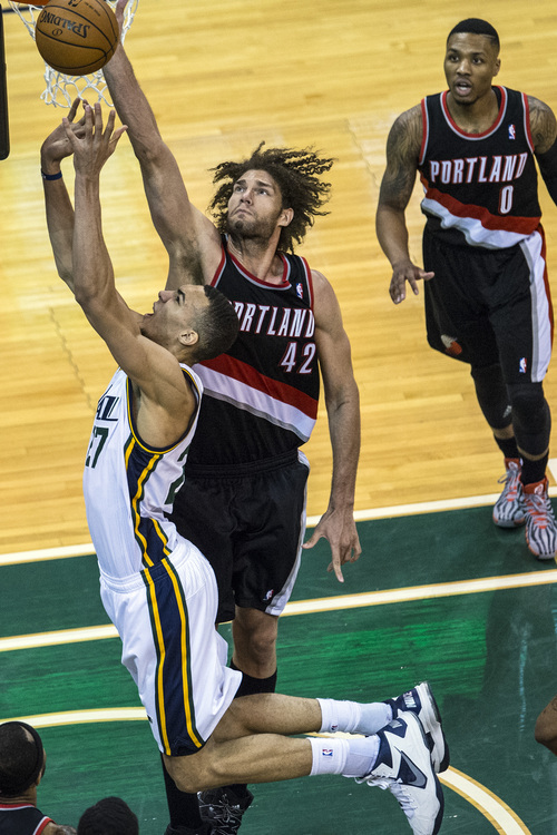Chris Detrick  |  The Salt Lake Tribune
Utah Jazz center Rudy Gobert (27) and Portland Trail Blazers center Robin Lopez (42) go for the ball during fourth quarter of the game at EnergySolutions Arena Saturday April 12, 2014. Portland won the game 111-99.