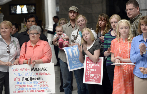 Al Hartmann  |  The Salt Lake Tribune
Supporters of Utah Amendment 3, the state's defense of marriage act listen to speaks at a rally at the Utah Capitol rotunda Friday April 11.