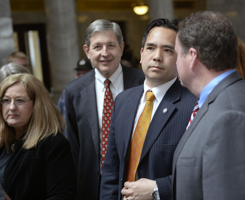 Al Hartmann  |  The Salt Lake Tribune
Utah Attorney General Sean Reyes, center, and Gene Schaer, left, who represented the state of Utah in Tenth Circuit Court in the defense of Amendment 3, mingle with supporters at a rally at the Utah Capitol rotunda Friday April 11.