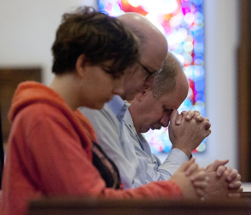 Steve Griffin | The Salt Lake Tribune

Charles Black, right, of Salt Lake City, prays during a special prayer service for victims and all those affected by the Boston marathon bombs, at The Cathedral Church of Saint Mark in Salt Lake City, Utah Tuesday April 16, 2013.