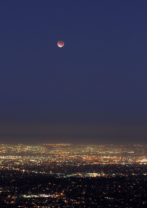 Francisco Kjolseth  |  The Salt Lake Tribune
A full lunar eclipse nears completion over Salt Lake City starting at 5:30 in the morning in December of 2011.