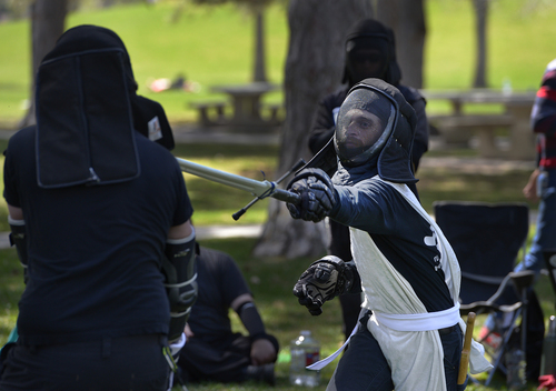 Scott Sommerdorf   |  The Salt Lake Tribune
Zeb Rentz-Bjorge, right, lunges to score points in his match against Stefan Tzourakis as members of the United Clans Swordsman Association compete in the Long Sword on the east side of Liberty Park on Saturday.