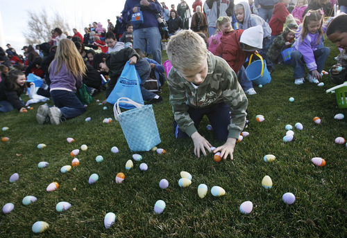 Scott Sommerdorf  |  Tribune file photo
Hundreds of kids scramble for their share of Easter eggs in this 2009 hunt at the Bees ballpark. Several egg hunts take place this weekend at various locations.