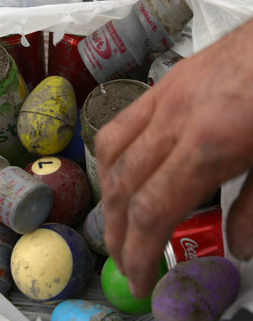 Leah Hogsten  |  The Salt Lake Tribune
Robert Kirby and friend Sonny Dyle also make their own ammunition by filling yogurt containers, soda cans and Easter eggs with cement to shoot out of the smaller cannons. The two enjoy shooting mostly bowling balls from a cannon they recently bought, Saturday, April 5, 2014 in Rush Valley, Utah.