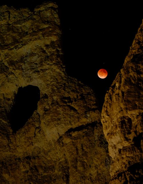 Franciso Kjolseth  |  The Salt Lake Tribune
The moon is eclipsed by the Earth's Shadow early Tuesday morning as seen from Bryce Canyon near the E.T. formation as it is affectionately known by the local rangers. Bryce Canyon, famed for its dark skies is a great place to marvel at the stars and this week's blood moon.