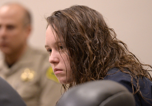 Al Hartmann  |  The Salt Lake Tribune
Meagan Grunwald, a teen charged in connection with fatal officer shooting in Utah County listens to testimony in her preliminary hearing in Judge Darold McDade's courtroom in Provo Wednesday April 16.
