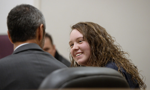 Al Hartmann  |  The Salt Lake Tribune
Meagan Grunwald, a teen charged in connection with fatal officer shooting in Utah County talks to one of her defense lawyers during a break in her preliminary hearing in Judge Darold McDade's courtroom in Provo Wednesday April 16.
