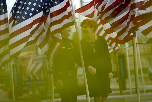 Leah Hogsten  |  The Salt Lake Tribune
West Jordan officer Tyrell Shepard and his wife Samantha walk amid the flags place outside Granger High School during "Utah Heroes Night," hosted by the Utah Fraternal Order of Police that honored 20 Utah officers for their heroic actions taken last year at Granger High School, Tuesday, April 15, 2014.