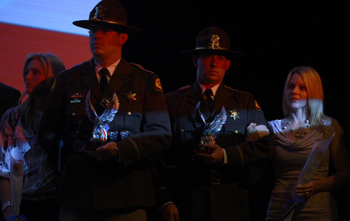 Leah Hogsten  |  The Salt Lake Tribune
Utah Highway Patrol Trooper Aaron Colvin, joined by his wife Jenny, (left) and Trooper Steve Marble, joined by his wife Katie, (right) were honored by the Utah Fraternal Order of Police. "Utah Heroes Night," hosted by the Utah Fraternal Order of Police honored 20 Utah officers for their heroic actions taken last year at Granger High School, Tuesday, April 15, 2014.