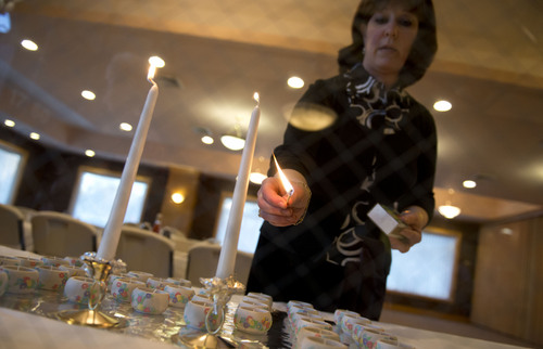 Lennie Mahler  |  The Salt Lake Tribune
Sharonne Zippel lights candles before the Passover Seder at Chabad Lubavitch of Utah, Monday, April 14, 2014.
