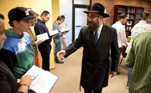Lennie Mahler  |  The Salt Lake Tribune
Rabbi Benny Zippel welcomes members of Chabad Lubavitch of Utah and leads them in song before the Passover Seder on Monday, April 14, 2014.