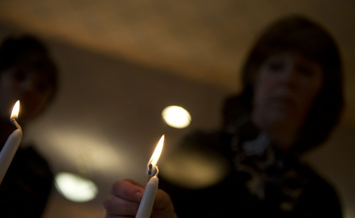 Lennie Mahler  |  The Salt Lake Tribune
Sharonne Zippel lights candles before the Passover Seder at Chabad Lubavitch of Utah, Monday, April 14, 2014.