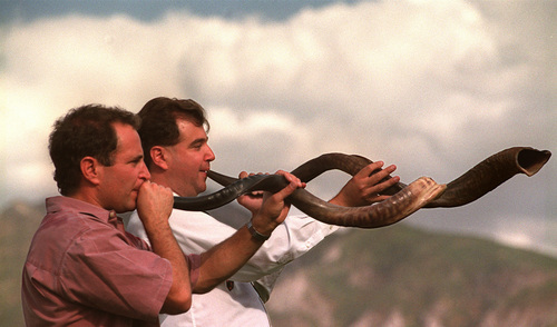 Tribune file photo
Jewish High Holy days gave us the opportunity to explore the nature of ritual. Here, two brothers ó who happen to be professional musicians ó blow the shofar to herald the beginning of the sacred time.