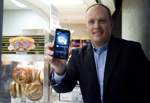 Kim Raff | The Salt Lake Tribune
Dave Roberts, the local Isis City Development Manager, holds a smartphone with the Isis system that allows you to use your smartphone to pay for things.