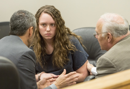 Rick Egan  |  The Salt Lake Tribune

Defense attorney's Rhome Zabriske (left) and Dean Zabriskie (right) visit with Meagan Grunwald, a teen charged in connection with fatal officer shooting in Utah County, during a recess in her preliminary hearing in Judge Darold McDade's courtroom in Provo Thursday April 17, 2014