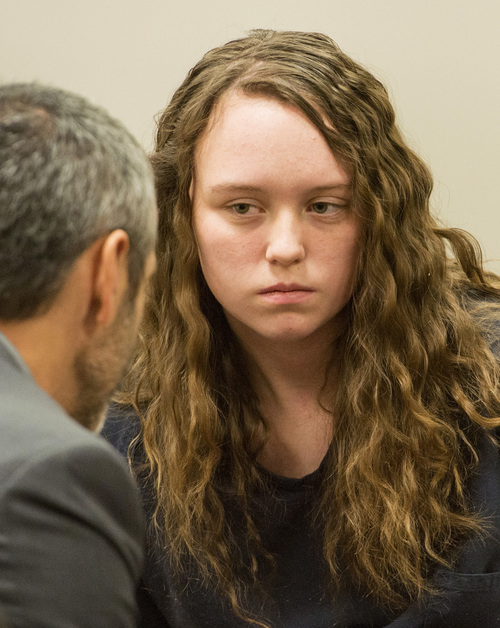 Rick Egan  |  The Salt Lake Tribune

Defense attorney's Rhome Zabriske talks with Meagan Grunwald, a teen charged in connection with fatal officer shooting in Utah County, during a recess in her preliminary hearing in Judge Darold McDade's courtroom in Provo Thursday April 17, 2014