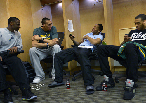 Scott Sommerdorf   |  The Salt Lake Tribune
Utah Jazz players, Ian Clark, left, Rudy Gobert, Trey Burke, and Malcolm Thomas, right, talk and check their cell phones in the locker room on the day the Jazz clean out their lockers after a disappointing 25-57 season, Thursday, April 17, 2014.