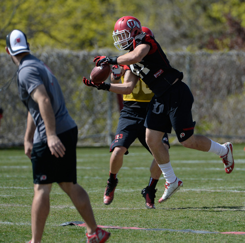Franciso Kjolseth  |  The Salt Lake Tribune
University of Utah's Jared Norris pulls a pass as the team gets ready for the season during Spring practice at the Spence Eccles Football Facility on Thursday, April 17, 2014.