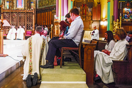 Chris Detrick  |  The Salt Lake Tribune
The Most Reverend John C. Wester, Bishop of Salt Lake City, second back on left, washes the feet of parishioners during the Mass of the Lord's Supper at The Cathedral of the Madeleine Thursday April 17, 2014.